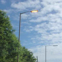 Street light on during the daytime, lighting and traffic lights